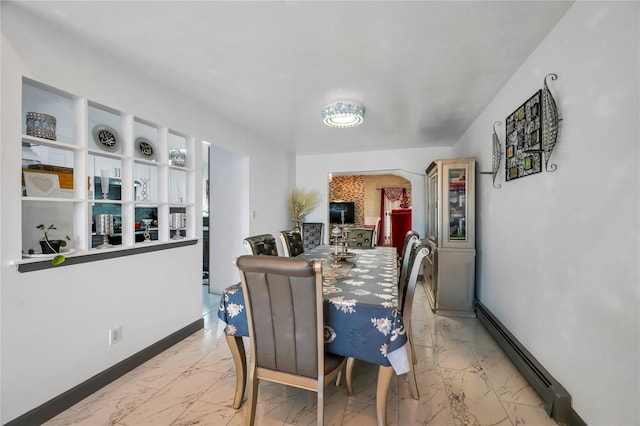 2A Belmont Ave Unit A, Plainview, NY 11803 - dining space with light marble finish floors, baseboards, and a baseboard heating unit