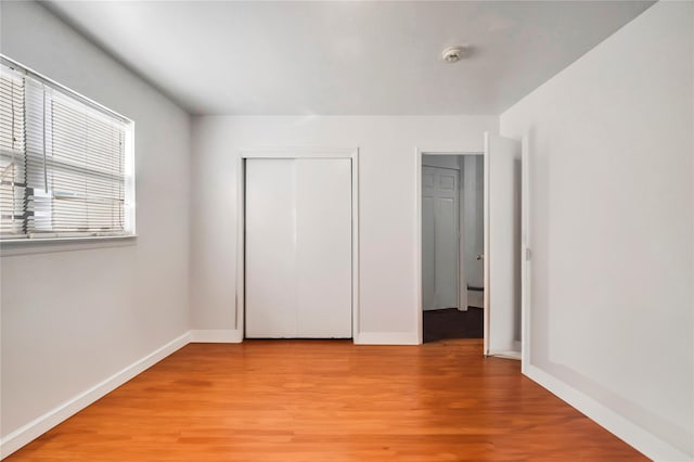 2A Belmont Ave Unit A, Plainview, NY 11803 - unfurnished bedroom with light wood-style floors, baseboards, and a closet