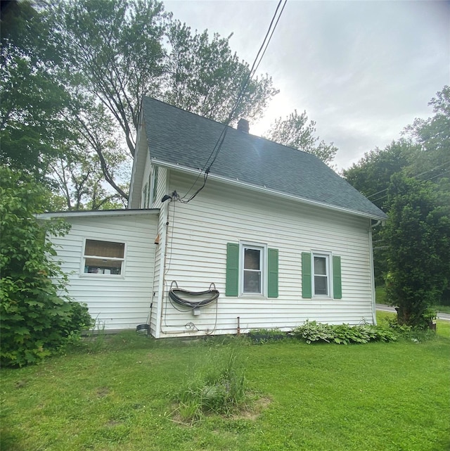 24 Rte 217, Hudson, NY 12534 - view of side of home with a yard, roof with shingles, and a chimney