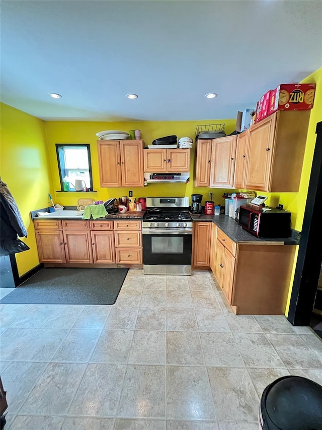 24 Rte 217, Hudson, NY 12534 - kitchen featuring stainless steel gas range oven, range hood, dark countertops, recessed lighting, and light stone finish flooring
