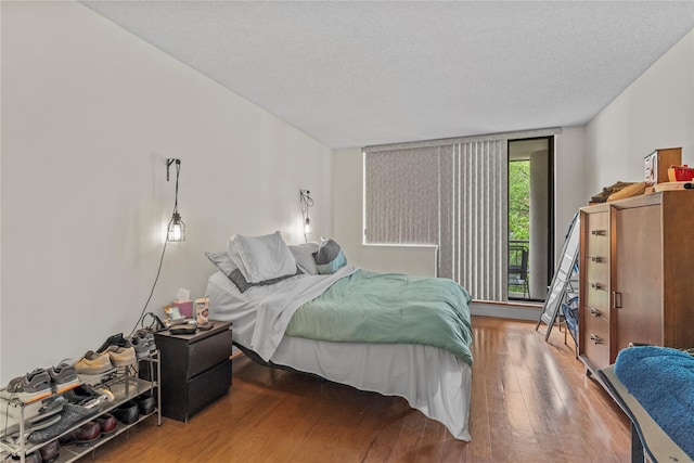 50 E Hartsdale Ave Unit 3S, Hartsdale, NY 10530 - bedroom featuring wood finished floors and a textured ceiling