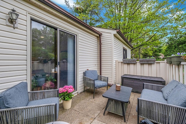 view of patio with a jacuzzi
