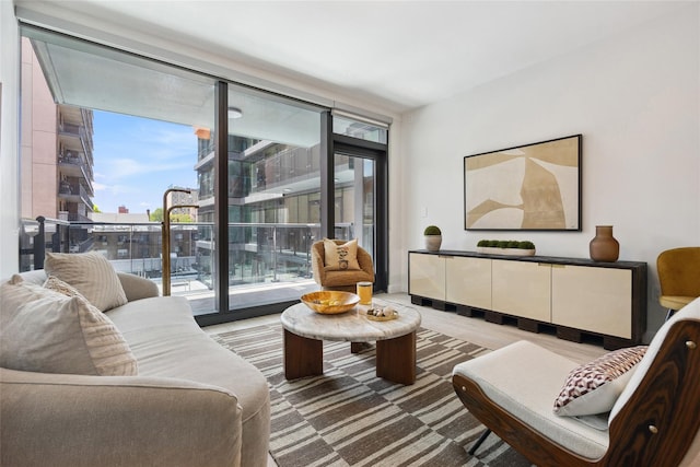living room with healthy amount of natural light and floor to ceiling windows