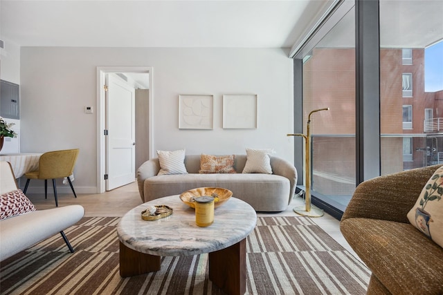 living room featuring wood finished floors and baseboards