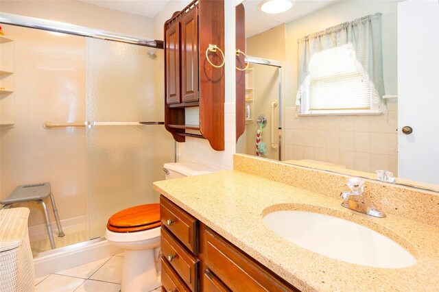 33 Roberts Rd, Wappingers Falls, NY 12590 - full bathroom featuring a stall shower, tile patterned flooring, toilet, and vanity