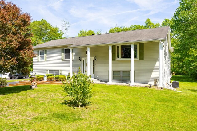 33 Roberts Rd, Wappingers Falls, NY 12590 - split foyer home with a front lawn and central air condition unit