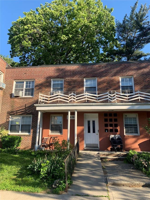 138-10 77th Ave Unit 60E, Kew Garden Hills, NY 11367 - townhome / multi-family property with brick siding and a balcony