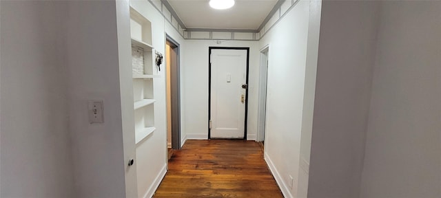 138-10 77th Ave Unit 60E, Kew Garden Hills, NY 11367 - hall featuring dark wood finished floors, built in shelves, and baseboards