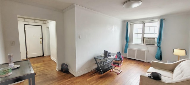 138-10 77th Ave Unit 60E, Kew Garden Hills, NY 11367 - sitting room featuring radiator, ornamental molding, wood finished floors, and baseboards