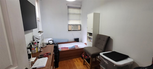 138-10 77th Ave Unit 60E, Kew Garden Hills, NY 11367 - bedroom with wood finished floors and cooling unit
