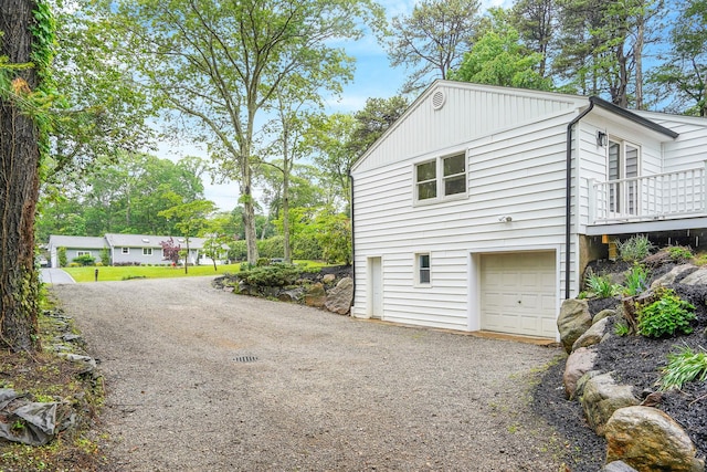 3 Thomas Dr, Wading River, NY 11792 - view of property exterior featuring driveway and a garage
