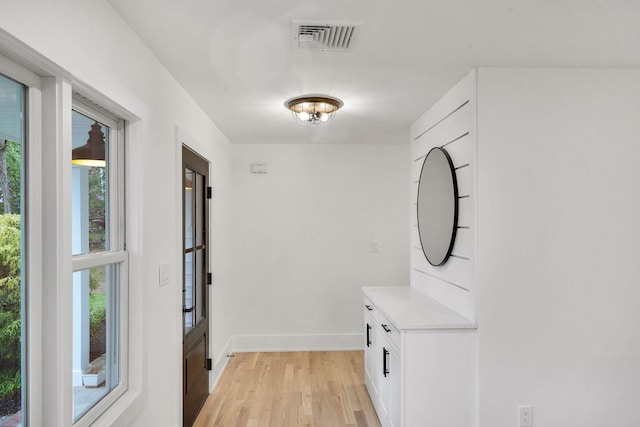 3 Thomas Dr, Wading River, NY 11792 - doorway to outside featuring light wood-style floors and baseboards