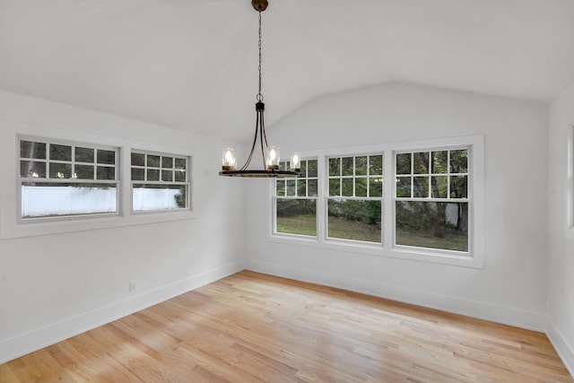3 Thomas Dr, Wading River, NY 11792 - unfurnished dining area featuring a chandelier, lofted ceiling, light wood-style flooring, and baseboards