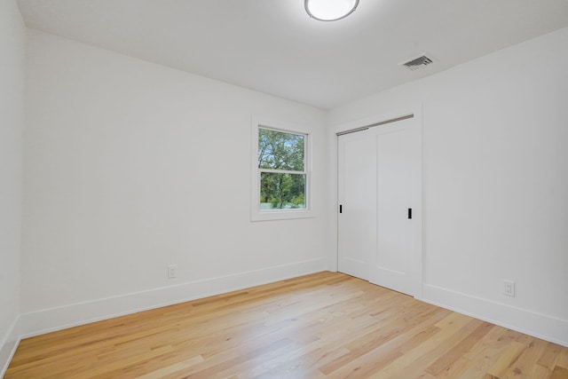 3 Thomas Dr, Wading River, NY 11792 - unfurnished bedroom featuring light wood finished floors, baseboards, and a closet