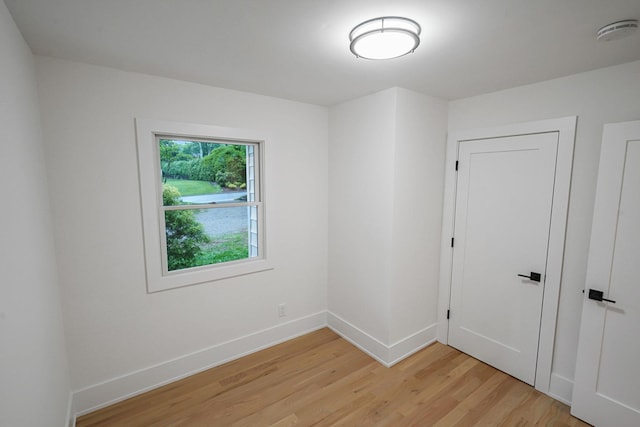 3 Thomas Dr, Wading River, NY 11792 - unfurnished room featuring light wood-style flooring, a smoke detector, and baseboards