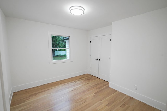 3 Thomas Dr, Wading River, NY 11792 - unfurnished bedroom featuring light wood-style floors, baseboards, and a closet