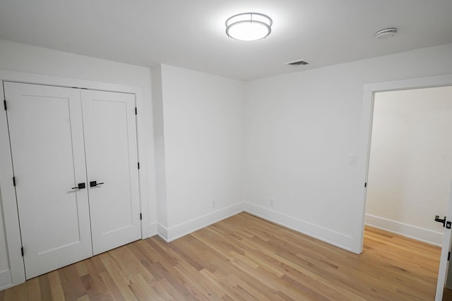 3 Thomas Dr, Wading River, NY 11792 - unfurnished bedroom with light wood finished floors, baseboards, and a closet
