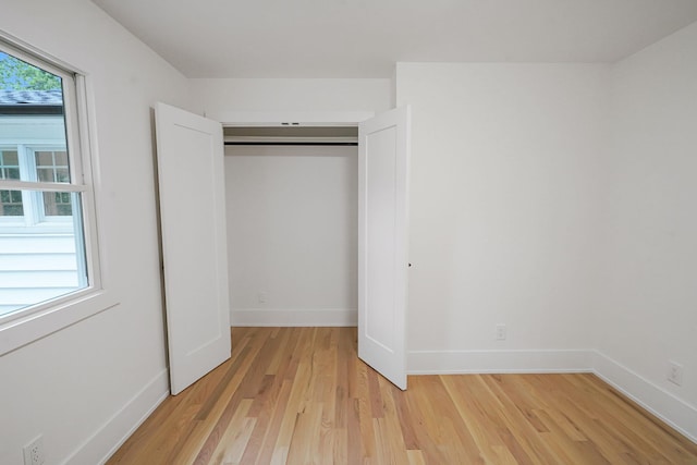 3 Thomas Dr, Wading River, NY 11792 - unfurnished bedroom featuring light wood finished floors, a closet, and baseboards