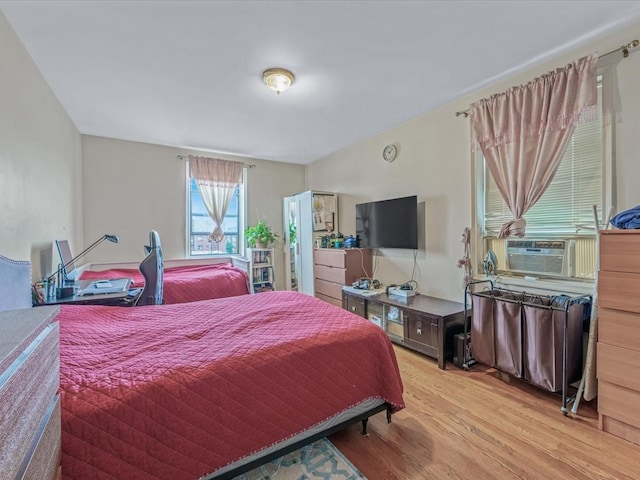 bedroom with wood finished floors