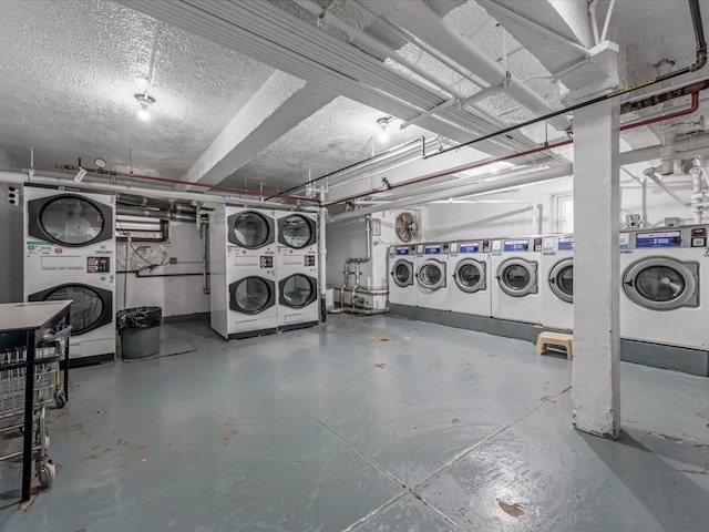 garage featuring stacked washer / drying machine and independent washer and dryer