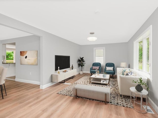 3 Idlewild Dr, Hyde Park, NY 12601 - living room with plenty of natural light, wood finished floors, and baseboards