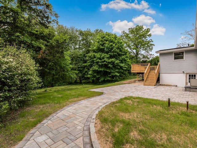 3 Idlewild Dr, Hyde Park, NY 12601 - view of grassy yard with a patio, a wooden deck, and stairs