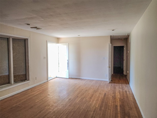 144 Union Ave, Patchogue, NY 11772 - empty room featuring wood finished floors and baseboards
