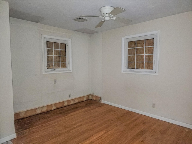 144 Union Ave, Patchogue, NY 11772 - empty room with wood finished floors, ceiling fan, and baseboards