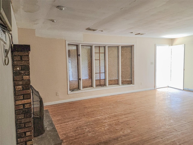 144 Union Ave, Patchogue, NY 11772 - unfurnished living room featuring wood finished floors and baseboards