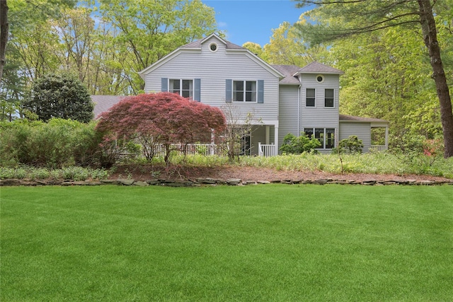 6 Carriage Path, Manorville, NY 11949 - view of front of property with a front lawn and roof with shingles
