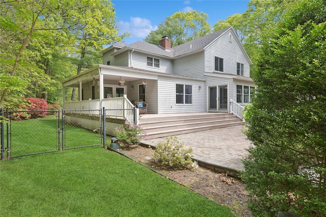 6 Carriage Path, Manorville, NY 11949 - rear view of property featuring a gate, a chimney, roof with shingles, and covered porch