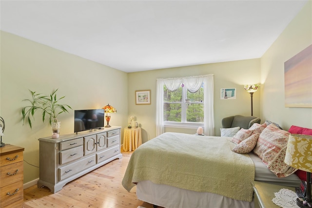 6 Carriage Path, Manorville, NY 11949 - bedroom with light wood-style flooring and baseboards