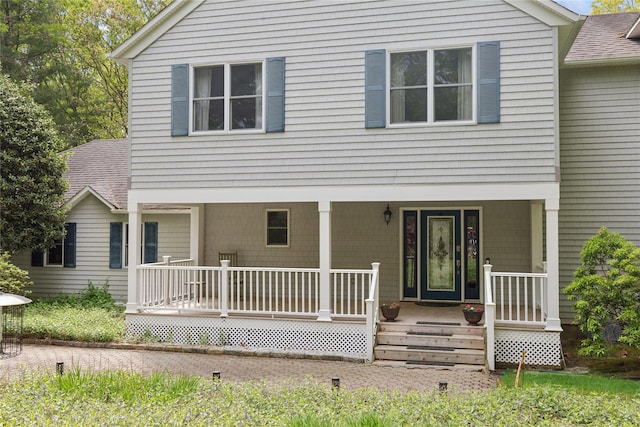 6 Carriage Path, Manorville, NY 11949 - view of front of home featuring covered porch and a shingled roof