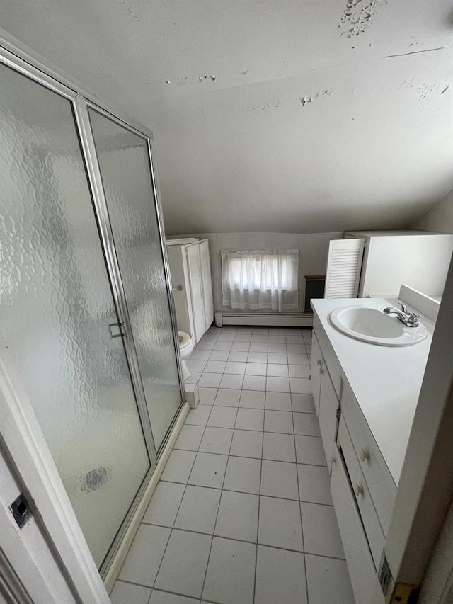 bathroom with vanity, a stall shower, tile patterned flooring, and toilet