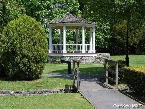 view of home's community with a gazebo and a lawn