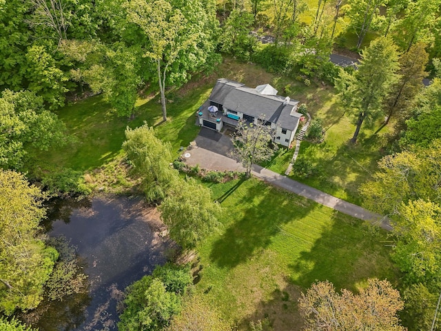 aerial view of property's location with a nearby body of water
