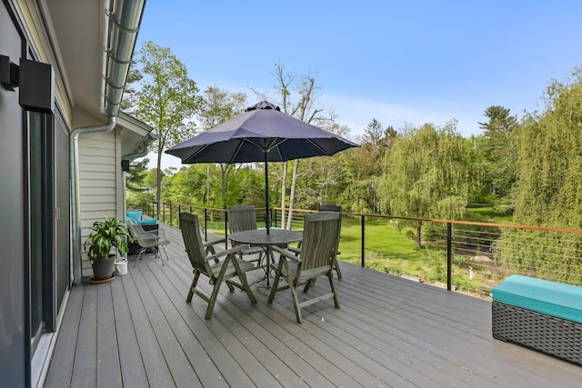deck with outdoor dining area