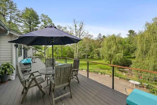 wooden terrace with outdoor dining area