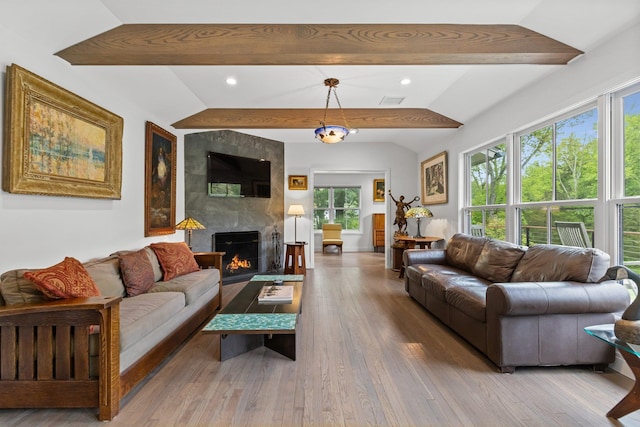 living room with hardwood / wood-style floors, a fireplace, and recessed lighting