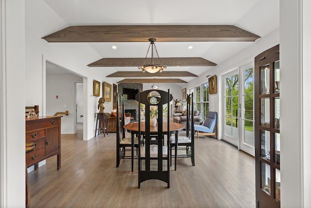 dining room featuring wood finished floors, recessed lighting, and baseboards