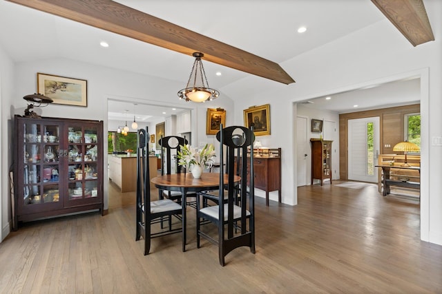 dining area featuring wood finished floors, recessed lighting, and a chandelier