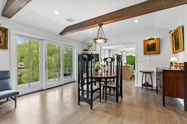 dining room with hardwood / wood-style flooring, recessed lighting, and baseboards