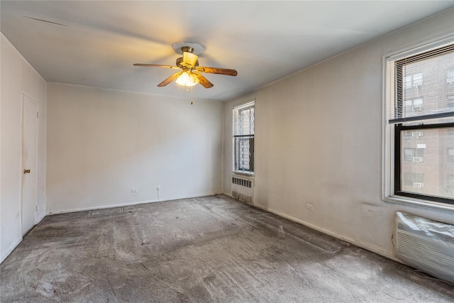 102-30 Queens Blvd Unit 3R, Forest Hills, NY 11375 - carpeted empty room with plenty of natural light, a ceiling fan, and radiator heating unit