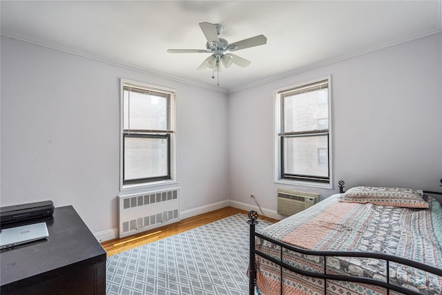 102-30 Queens Blvd Unit 3R, Forest Hills, NY 11375 - bedroom featuring radiator, multiple windows, wood finished floors, ornamental molding, and an AC wall unit