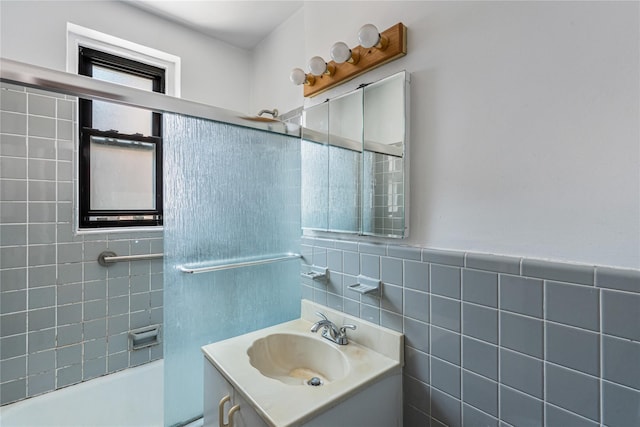102-30 Queens Blvd Unit 3R, Forest Hills, NY 11375 - full bathroom featuring vanity, tile walls, and shower / washtub combination
