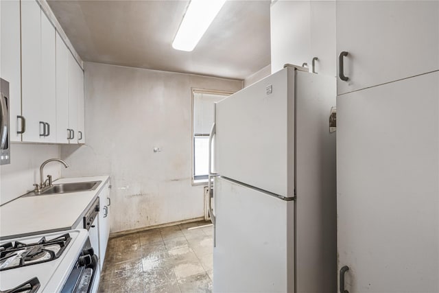 102-30 Queens Blvd Unit 3R, Forest Hills, NY 11375 - kitchen with freestanding refrigerator, white cabinets, range with gas cooktop, and light countertops
