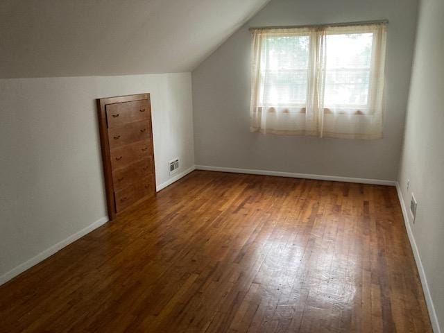 16615 67th Ave, Fresh Meadows, NY 11365 - bonus room with wood-type flooring, vaulted ceiling, and baseboards