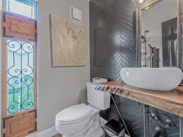 12 Deepwater Way Unit 31, Bronx, NY 10464 - bathroom featuring a sink, toilet, and baseboards