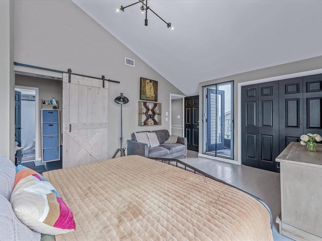 12 Deepwater Way Unit 31, Bronx, NY 10464 - bedroom with a barn door, wood finished floors, and high vaulted ceiling
