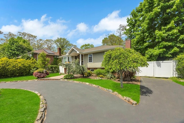 25 Terrace View Rd, Farmingdale, NY 11735 - bi-level home featuring driveway and a chimney